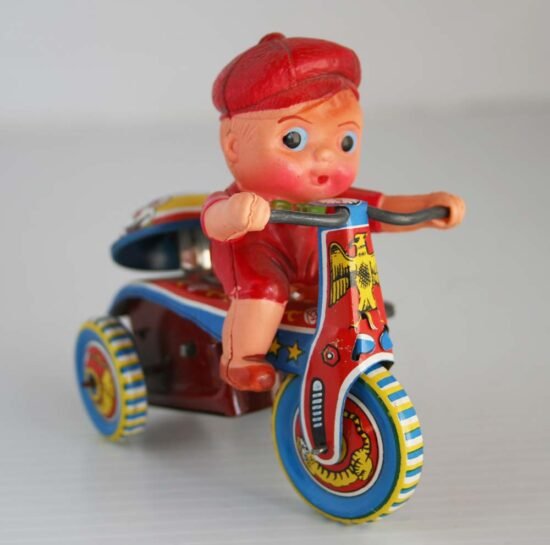 1Unknown BrandTWTCelluloidDollOnTricycle